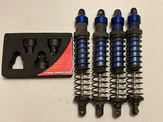 XMaxx Shocks (4) and Shock Caps (3)
