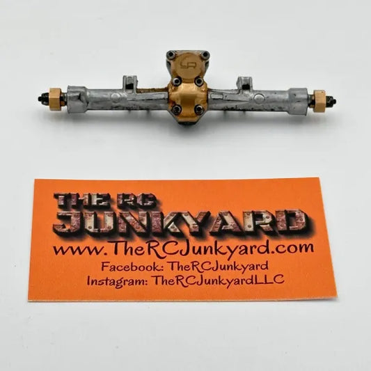 Axial SCX24 Plastic Rear Axle (Painted Silver) w/Brass Hexes & Yeah Racing Brass Diff Cover